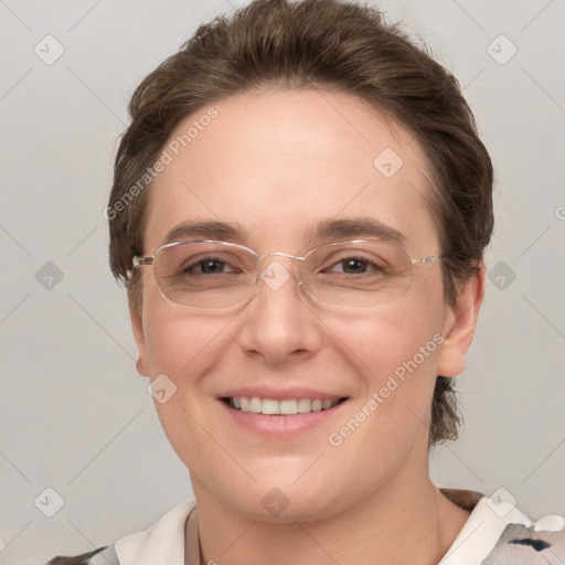 Joyful white adult female with short  brown hair and grey eyes