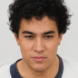 Neutral latino young-adult male with short  brown hair and brown eyes