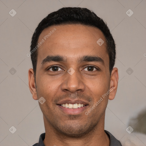 Joyful white young-adult male with short  black hair and brown eyes