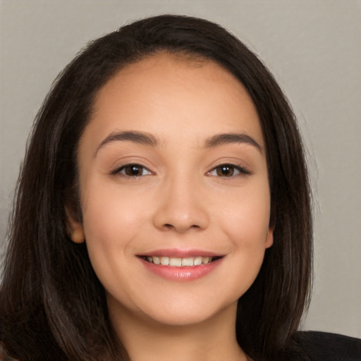 Joyful white young-adult female with long  brown hair and brown eyes