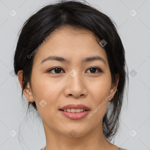 Joyful asian young-adult female with medium  brown hair and brown eyes