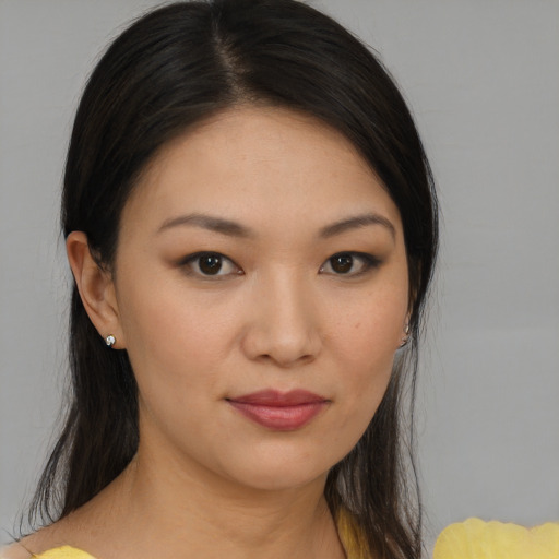 Joyful asian young-adult female with medium  brown hair and brown eyes