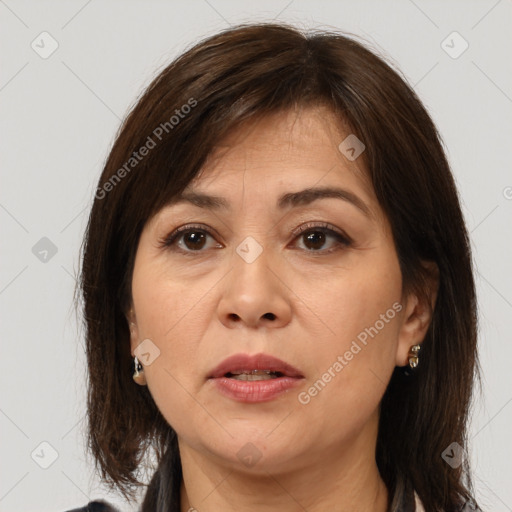 Joyful white adult female with medium  brown hair and brown eyes