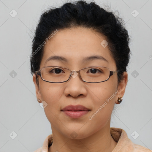 Joyful latino adult female with short  brown hair and brown eyes