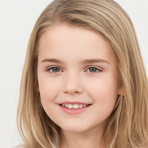 Joyful white child female with long  brown hair and brown eyes