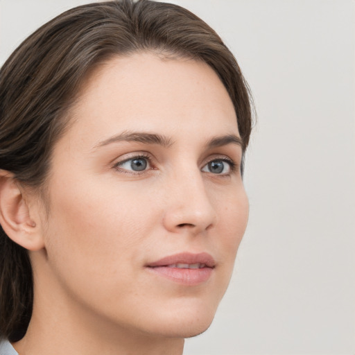 Neutral white young-adult female with medium  brown hair and grey eyes