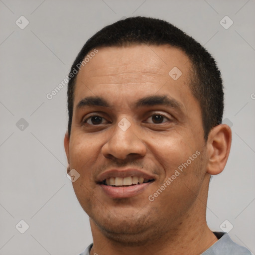 Joyful white young-adult male with short  black hair and brown eyes