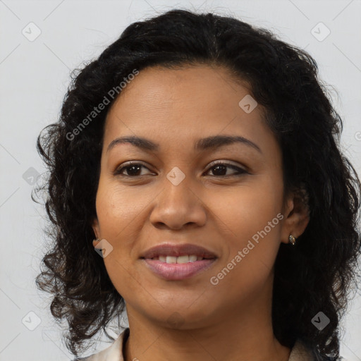 Joyful black young-adult female with long  brown hair and brown eyes