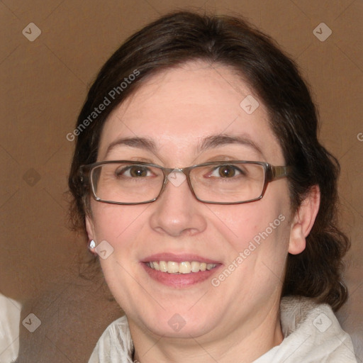 Joyful white adult female with medium  brown hair and blue eyes