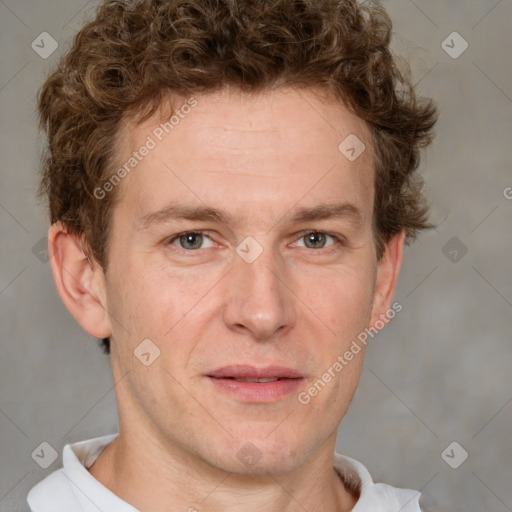 Joyful white adult male with short  brown hair and grey eyes