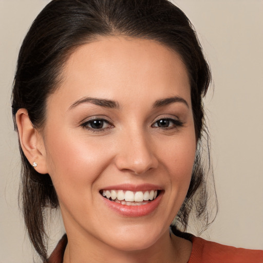 Joyful white young-adult female with medium  brown hair and brown eyes