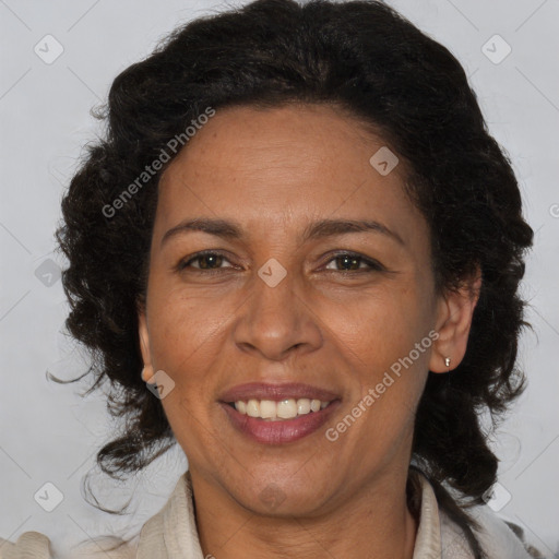 Joyful black adult female with medium  brown hair and brown eyes