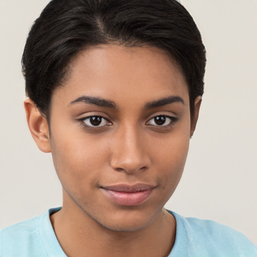 Joyful latino young-adult female with short  brown hair and brown eyes