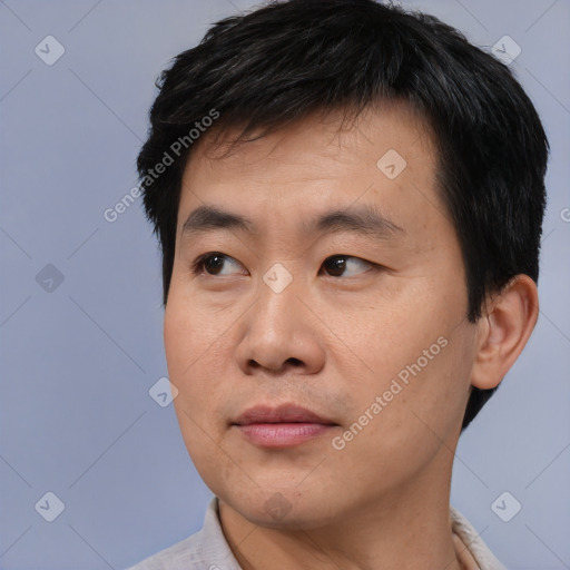Neutral asian young-adult male with short  black hair and brown eyes