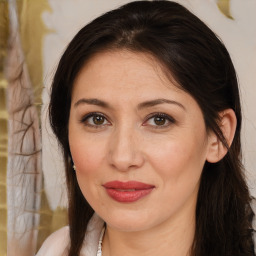 Joyful white adult female with medium  brown hair and brown eyes