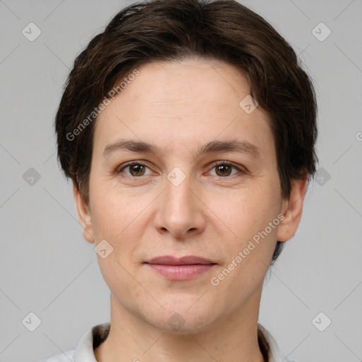 Joyful white adult female with short  brown hair and brown eyes