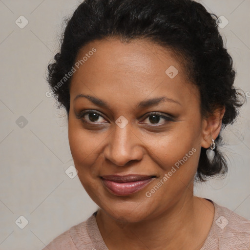 Joyful black adult female with medium  brown hair and brown eyes