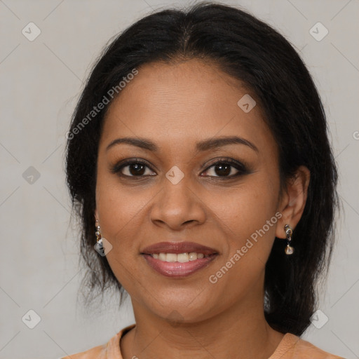 Joyful black young-adult female with medium  brown hair and brown eyes