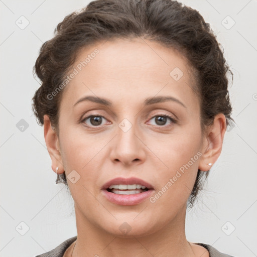 Joyful white young-adult female with short  brown hair and grey eyes