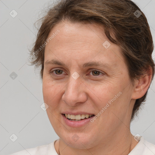 Joyful white adult female with short  brown hair and brown eyes