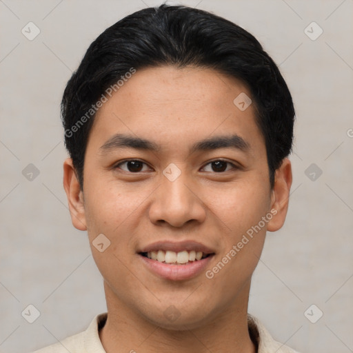 Joyful asian young-adult male with short  black hair and brown eyes