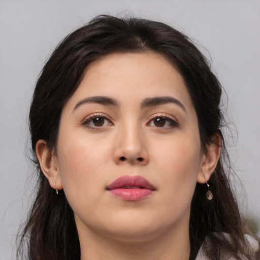 Neutral white young-adult female with long  brown hair and brown eyes