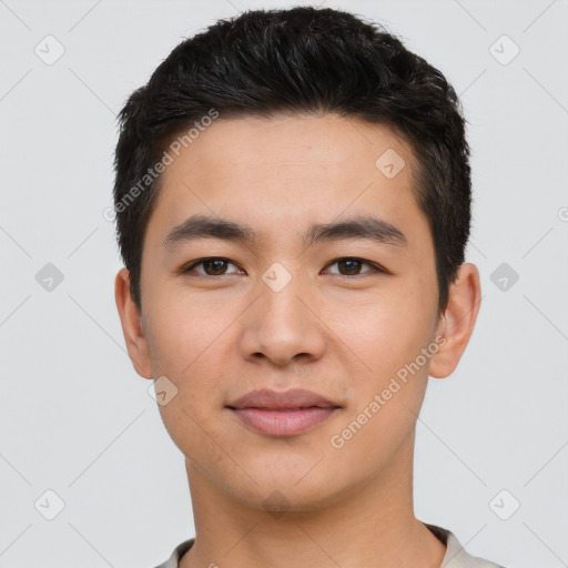 Joyful asian young-adult male with short  black hair and brown eyes