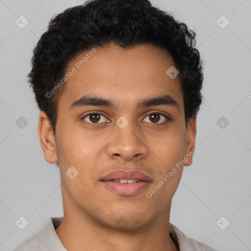 Joyful latino young-adult male with short  brown hair and brown eyes