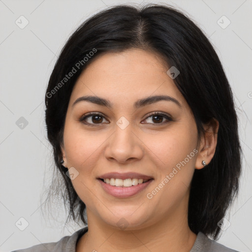 Joyful latino young-adult female with medium  black hair and brown eyes