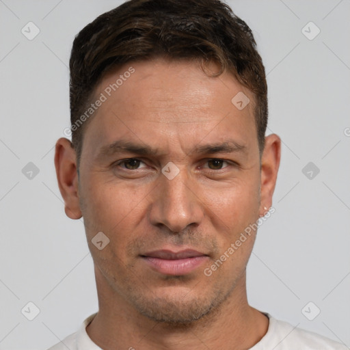 Joyful white adult male with short  brown hair and brown eyes