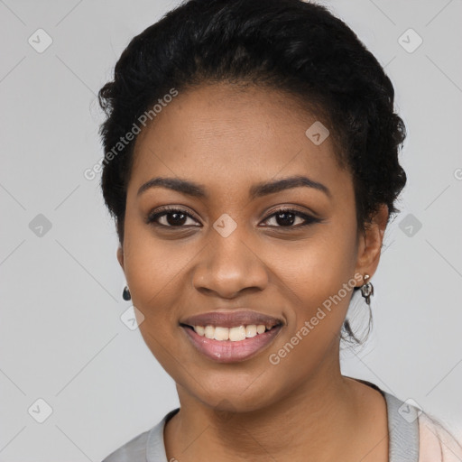 Joyful black young-adult female with long  black hair and brown eyes