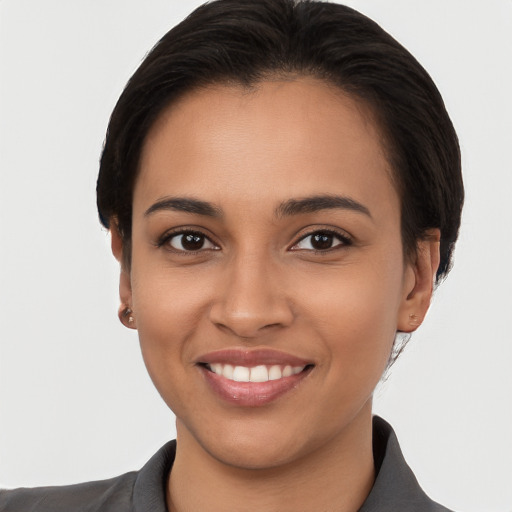 Joyful white young-adult female with short  brown hair and brown eyes