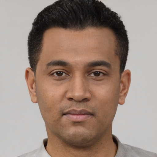 Neutral latino young-adult male with short  black hair and brown eyes