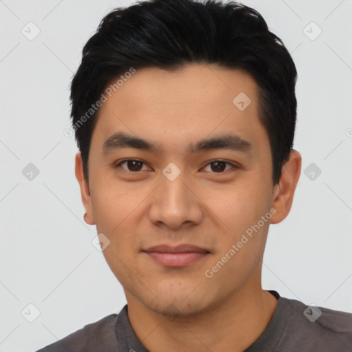 Joyful asian young-adult male with short  black hair and brown eyes