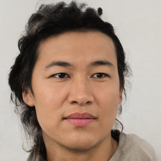 Joyful asian young-adult male with medium  brown hair and brown eyes