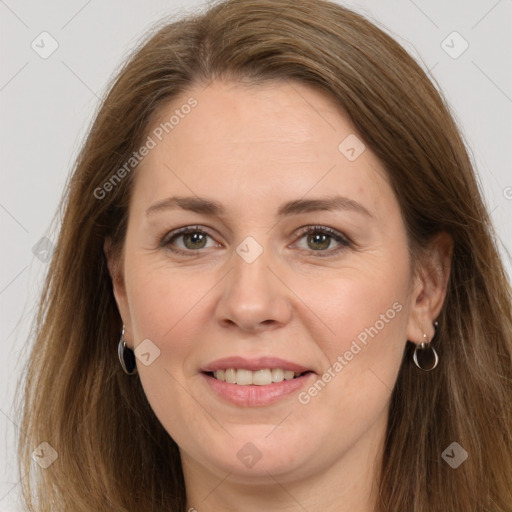 Joyful white adult female with long  brown hair and brown eyes