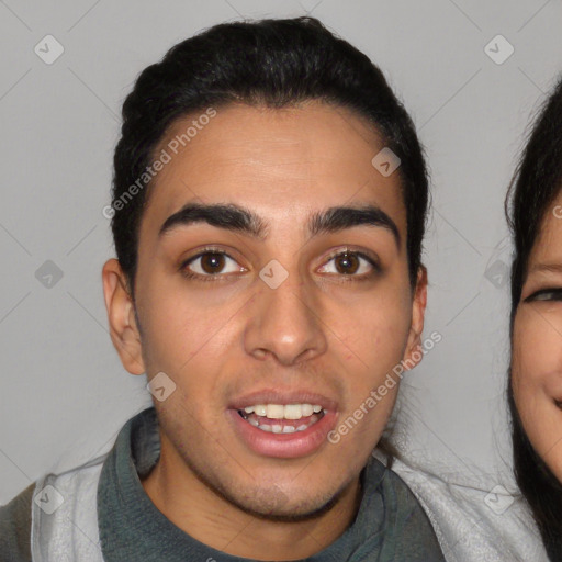 Joyful latino young-adult male with short  black hair and brown eyes