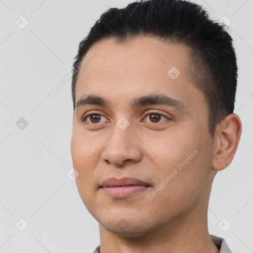 Joyful white young-adult male with short  black hair and brown eyes