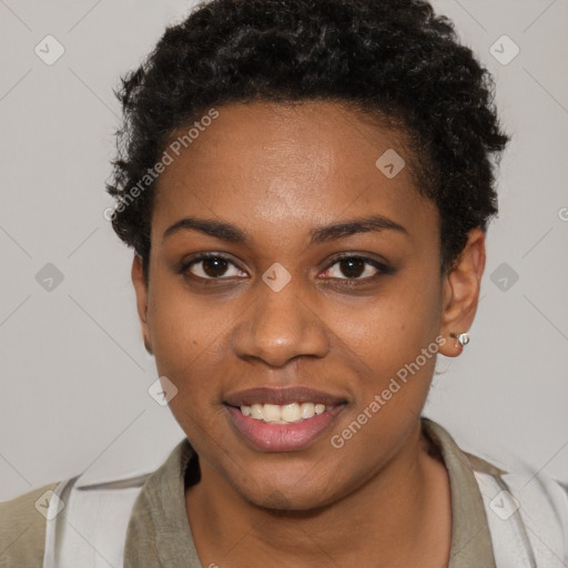 Joyful black young-adult female with short  brown hair and brown eyes