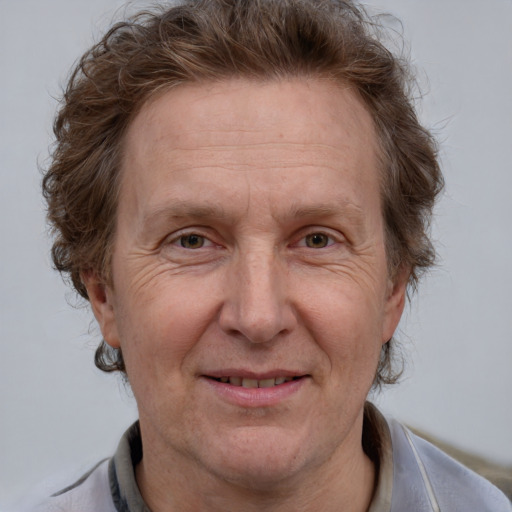 Joyful white middle-aged male with short  brown hair and brown eyes