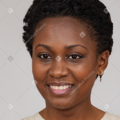 Joyful black young-adult female with short  brown hair and brown eyes