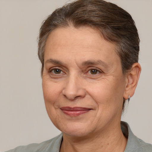 Joyful white middle-aged female with short  brown hair and brown eyes