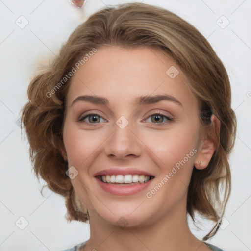 Joyful white young-adult female with medium  brown hair and blue eyes