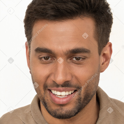 Joyful white young-adult male with short  brown hair and brown eyes