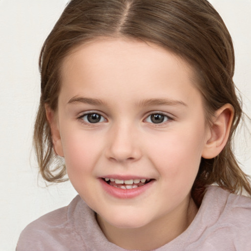 Joyful white child female with medium  brown hair and brown eyes