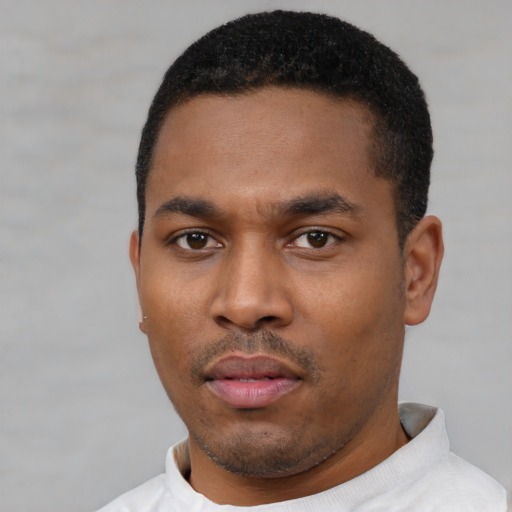 Neutral latino young-adult male with short  black hair and brown eyes