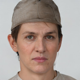 Neutral white adult female with short  brown hair and grey eyes