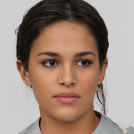 Neutral latino young-adult female with long  brown hair and brown eyes