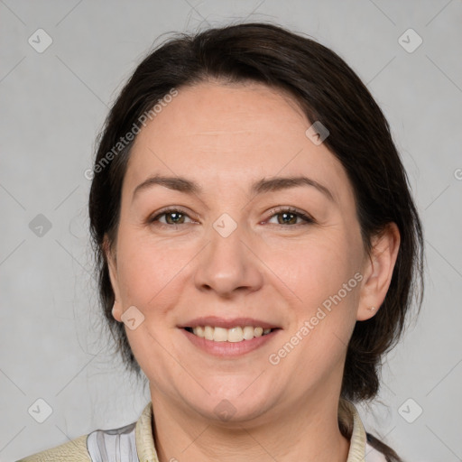 Joyful white adult female with medium  brown hair and brown eyes