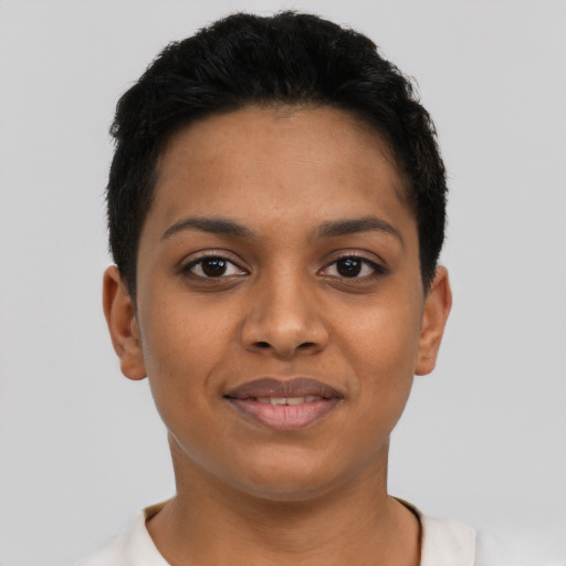 Joyful latino young-adult female with short  black hair and brown eyes